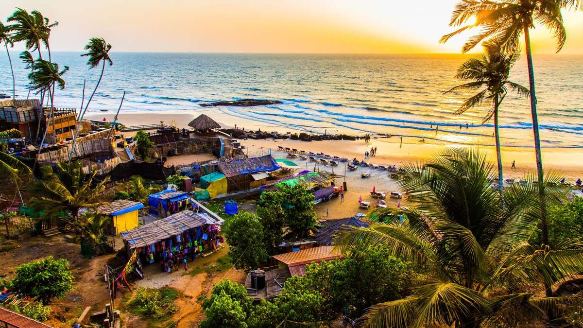 GOA written on beach sand